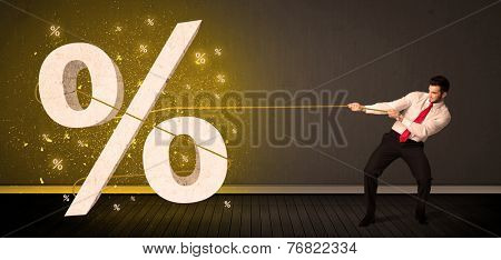 Business man pulling rope with big procent symbol sign concept on background