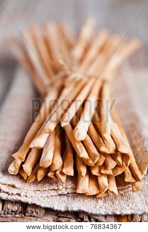 bread sticks grissini torinesi closeup on linen napkin