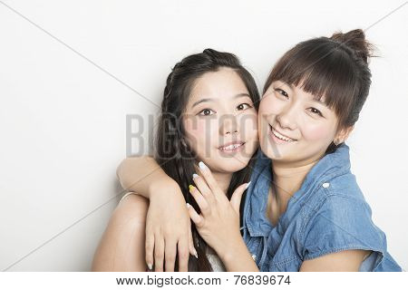Two Smiling Asian Girls
