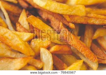 Golden French fries potatoes ready to be eaten. Slightly overcooked, that would be crispy