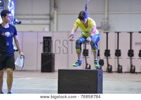 NOVOSIBIRSK, RUSSIA - NOVEMBER 16, 2014: Unidentified female athlete during the International crossfit competition Siberian Showdown. The competition is part of the festival Siberian Health.