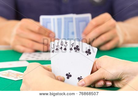Playing cards closeup of hands holding deck