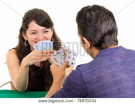 young couple playing cards cuarenta