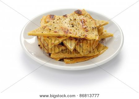 socca, farinata, chickpea pancake isolated on white background