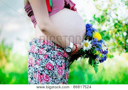 Happy Pragnant Women Outdoor In The Garden