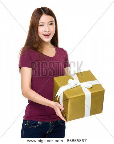 Beautiful girl holding a gift box