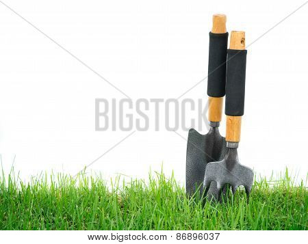 Fork And Spade On The Green Grass