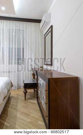 Dressing Table With Large Mirror In Bedroom Interior