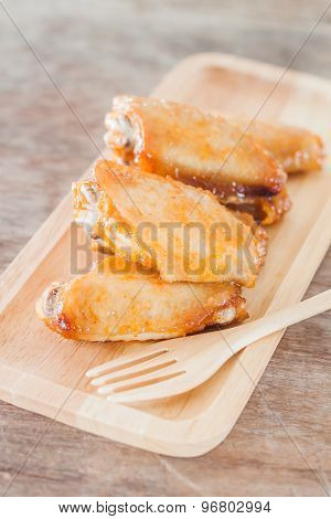 Grilled Chicken Wings On Wooden Plate