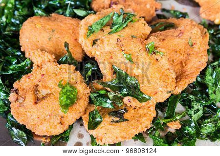Masala Vadai with curry leafs, a popular Southern Indian deep fried snack