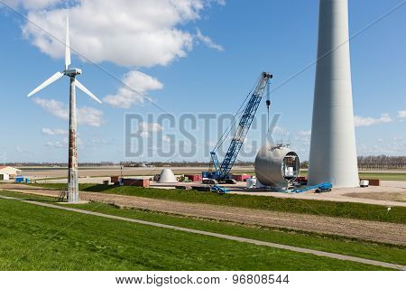 Farmland With Construction Work At The Biggest Windfarm Of The Netherlands
