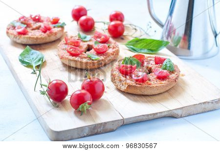 Friselle typical Italian bruschetta with corn tomato and basil