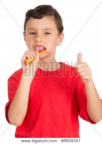 Young boy brushing his teeth signing OK