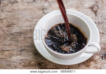 Coffee Splash Into A Cup Of Coffee