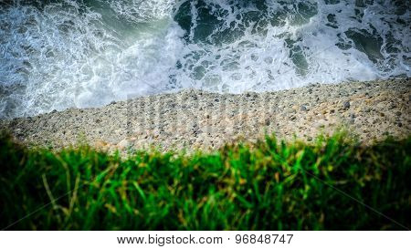 Water, Earth And Grass. Closeup Of A Cliff