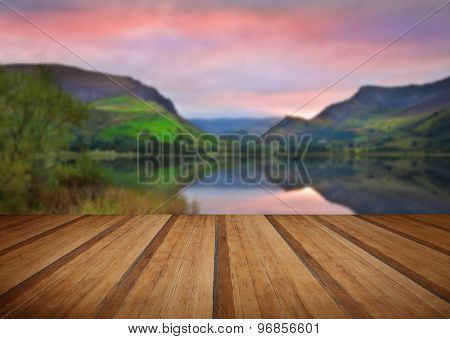 Llyn Nantlle At Sunrise Looking Towards Mist Shrouded Mount Snowdon With Wooden Planks Floor