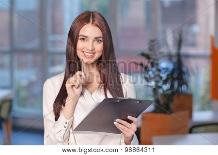 Smiling woman busy at work
