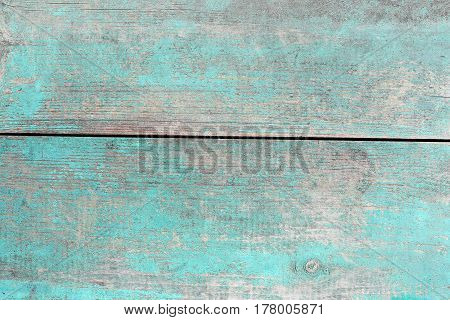 Wooden planks in the old blue paint