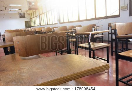 School classroom with desks chair wood and blackboard in high school thailand vintage tone education concept