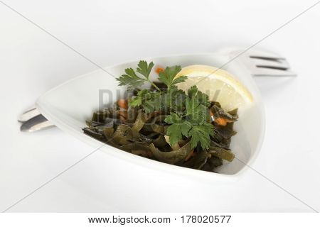 Sea cabbage dish. Spicy salad with heh seaweed and sesame. From a series of Food Korean cuisine.