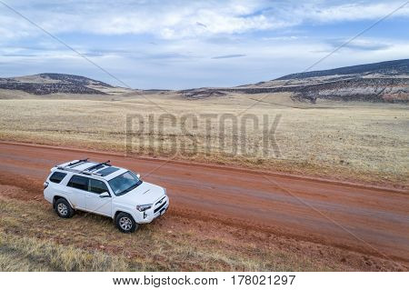 LIVERMORE,  CO, USA - March 22, 2017: Toyota 4Runner SUV (2016 Trail edition) on a dirt ranch road at foothils of  Rocky Mountains