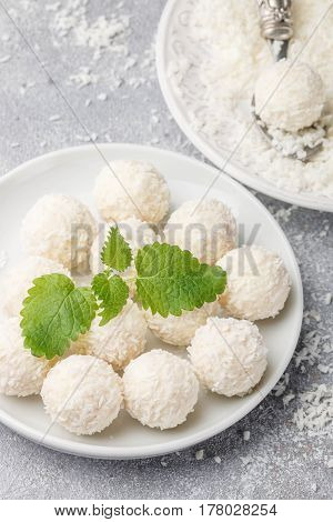 Homemade Coconut Candies In A White Plate On The Table. Sweets. Selective Focus