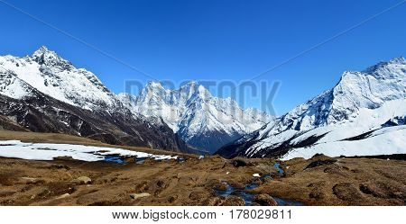 View of the magnificent Himalayan mountains on the background of blue sky Sagarmatha national park Nepal.