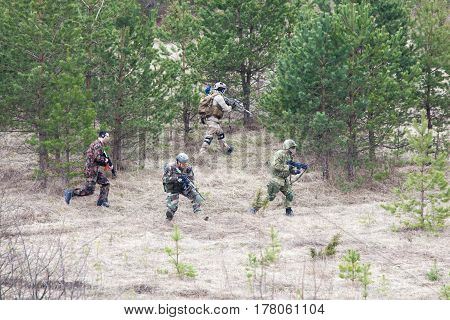 ESTONIA, APRIL 9, 2016: Unidentified people take part in the East-West Airsoft Game East at the Humala abandoned rocket base. 
