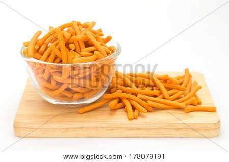 Cracker strick on glass bowl on white background
