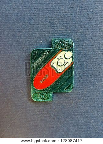 USSR - CIRCA 1980: Badge with a picture of a bobsledder and the inscription 