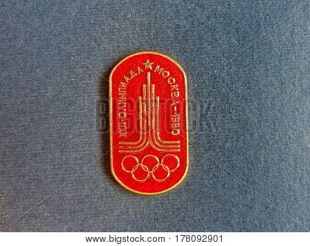 USSR - CIRCA 1980: Badge with the image of the emblem and Olympic rings and the inscription 