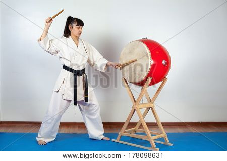 Woman In A Kimono Pounding The Drum