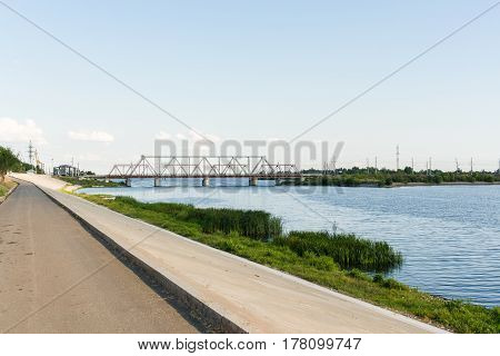 Pedestrian embankment and railway bridge through the river Volga in Syzran Russia.