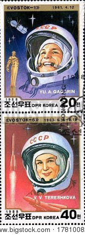 UKRAINE - CIRCA 2017: A set of two postage stamps printed in DPR KOREA shows first cosmonaut Gagarin and first cosmonaut woman Tereshkova circa 1988