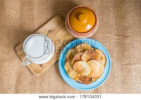 pancakes with jam, sour cream and milk
