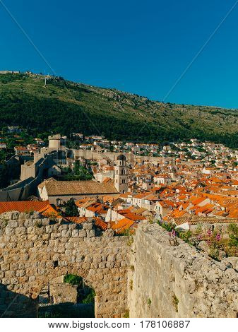 Dubrovnik Old Town, Croatia. Tiled roofs of houses. Church in the city. City View from the wall.