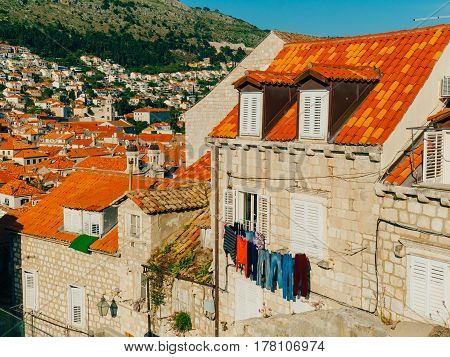 Dubrovnik Old Town, Croatia. Tiled roofs of houses. Church in the city. City View from the wall.