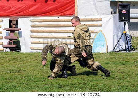 Tyumen, Russia - September 22, 2012: Avanpost training center on preparation of school students for army. Miles of Fire festival of live history. Performance of special troops. Work against knife