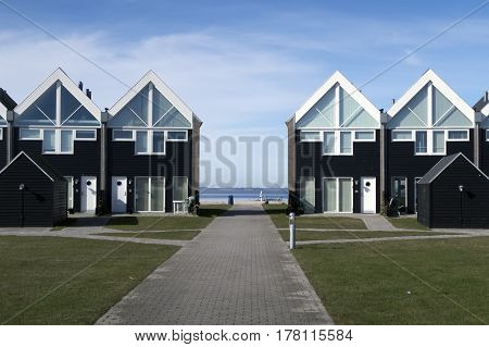 ASSENS DENMARK - MARCH 24 2017: Modern designed Danish terraced summer houses by the sea. March 24 2017 Assens Funen Denmark.