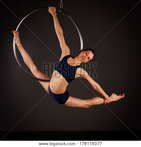 Woman Exercising On Lyra