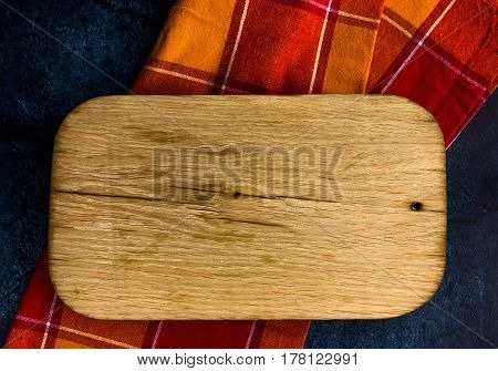 Rural kitchen board  on  old red cloth from above - grunge background with free text space. concrete background.  Different stuff. Top view.