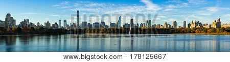 Morning panoramic view of Midtown Manhattan skyscrapers and the Central Park Reservoir in Fall. New York City