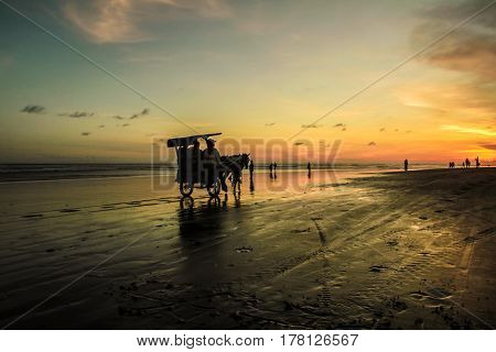 Sunset and silhouette at Parangtritis Beach, Central Java Indonesia