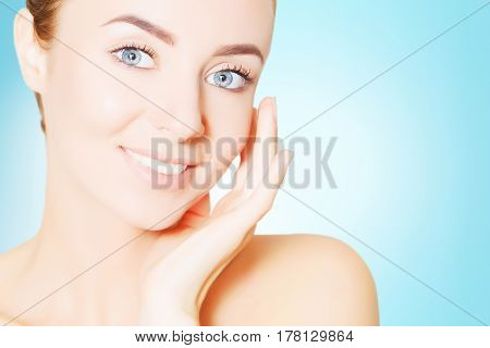 portrait of beautiful smiling woman with perfect skin