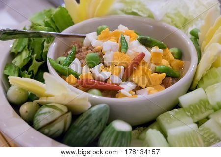 Naam Prik Long Rau chilli dip with pork and egg yolk Thai cuisine