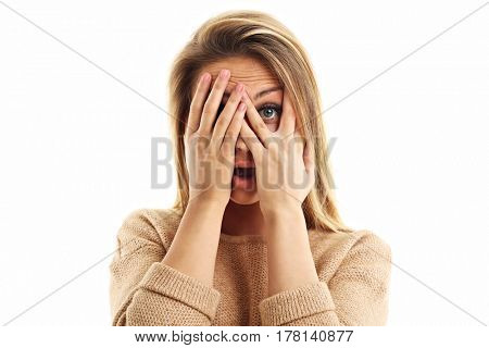 Afraid woman looking at camera isolated on a white background