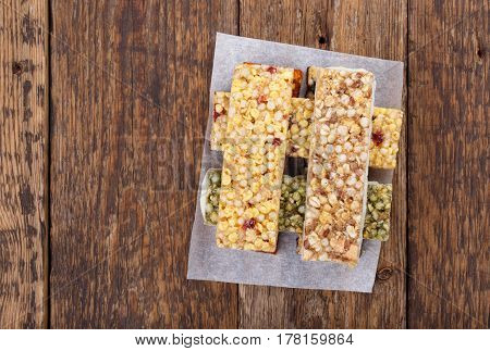 Various muesli / granola / fruit bars with nuts cereals dried berries. Healthy energy snack. Copy space. Top view.