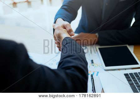 Successful Business Peolple Handshaking After Good Deal.