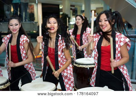 Moscow, Russia - March 25, 2017: Group Of Japanese Taiko Drummers Girls Perform In Kaleidoscope Shop