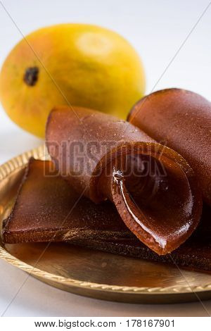 indian alphonso mango's dried jelly called mango papad or mango poli or slab or cake, traditional maharashtrian recipe